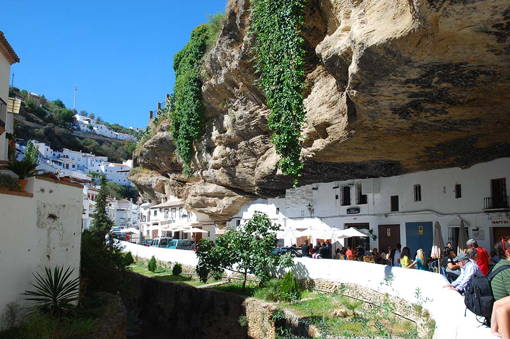 Setenil village, main street, built into the cliff, taken by Edible Bike Tours, Cadiz, Spain