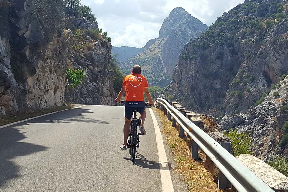 neil emery edible bike tour chef on ebike cycling on the road to montejaque in spain